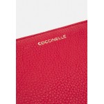 Coccinelle BEST - Across body bag - ruby/dark red